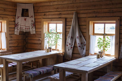 Potted plants on wooden table at home