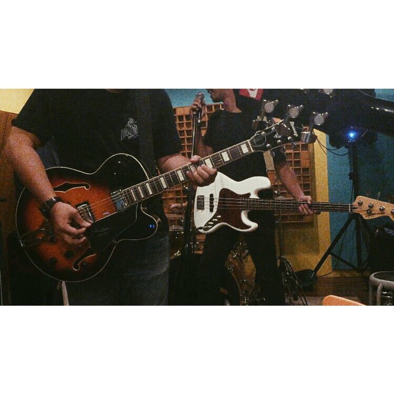 MAN PLAYING GUITAR AT MUSIC FESTIVAL