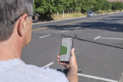 Close-up of man using mobile phone