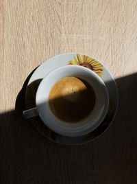 High angle view of coffee cup on table