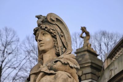 Low angle view of statue against sky