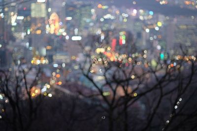 Defocused image of illuminated city at night