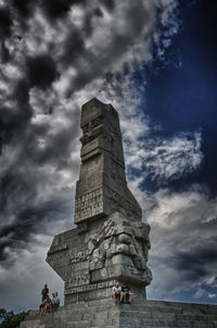 Low angle view of statue against cloudy sky