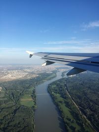 Cropped image of airplane flying over sea