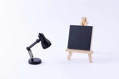 Close-up of electric lamp against white background