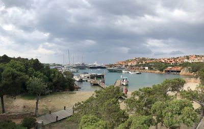 High angle view of marina against cloudy sky