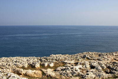 Scenic view of rock and sea against sky in havana.
