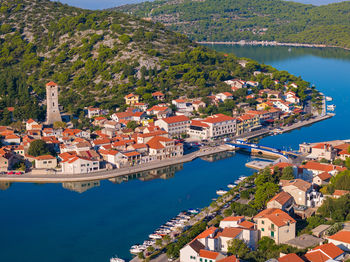 High angle view of city by sea