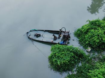 High angle view of boat moored in canal against sky