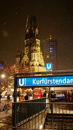 Low angle view of illuminated buildings at night