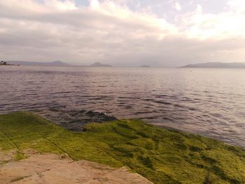 Scenic view of sea against cloudy sky