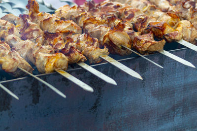 High angle view of meat on barbecue