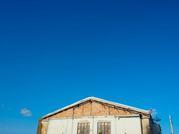 Low angle view of building against blue sky