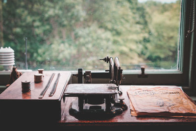 Close-up of vehicle on table by window