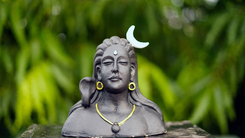 Lord ganesha, adiyogi and maa durga idol or statue isolated at green leaves background. indian 