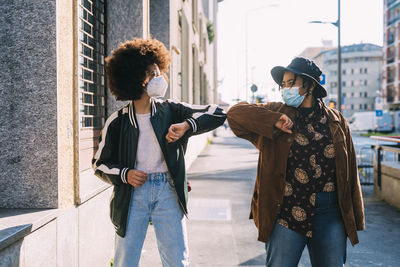 People standing on street in city