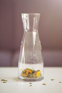 Close-up of water in jar on table