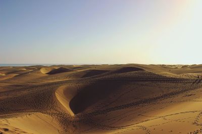 Scenic view of desert against clear sky