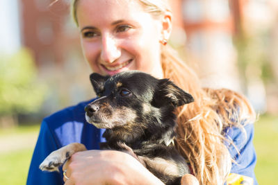 Portrait of woman with dog