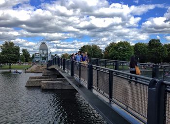 View of bridge over river against cloudy sky
