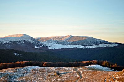 Scenic view of mountains against sky during winter