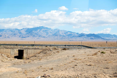 Scenic view of landscape and mountains against sky