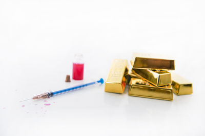 Close-up of objects on table against white background