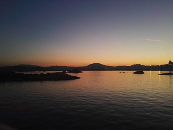 Scenic view of sea against clear sky during sunset