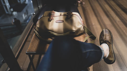 High angle view of man sitting on floor