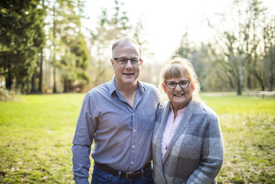 Portrait of vibrant happy elderly couple outdoors.