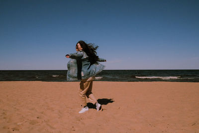 View of girl on beach