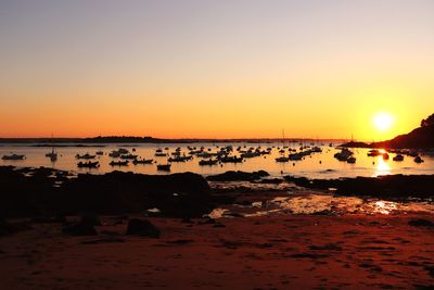 Scenic view of sea against clear sky during sunset