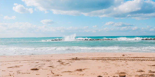 Scenic view of beach against sky