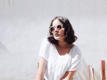 Portrait of young woman wearing sunglasses