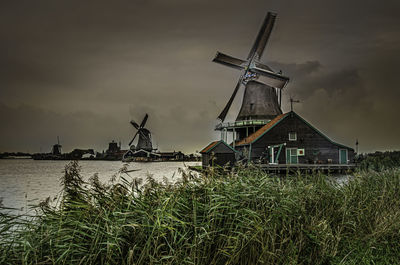 Traditional windmill against sky