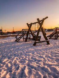 Scenic view of snow against sky during sunset