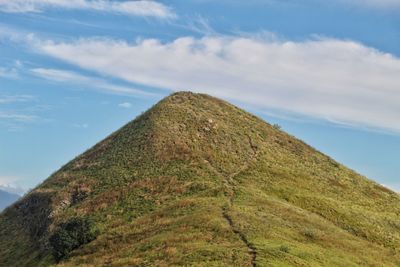 Low angle view of hill against sky