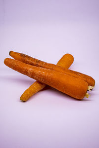 Close-up of cake on plate against white background
