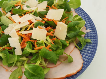 High angle view of chopped vegetables in bowl on table