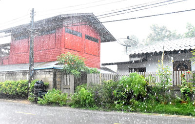 Exterior of house by road against sky