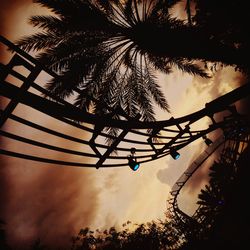 Low angle view of silhouette trees against sky at sunset