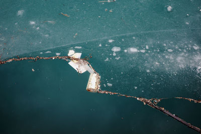 High angle view of debris and garbage on lake