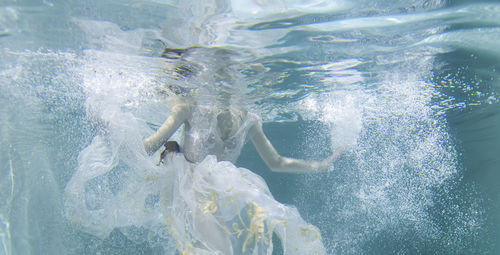 High angle view of man swimming in pool