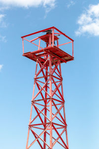 Low angle view of communications tower against sky