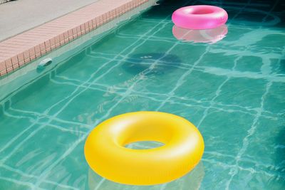High angle view of person floating on swimming pool