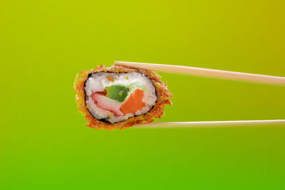 Close-up of a sushi over white background