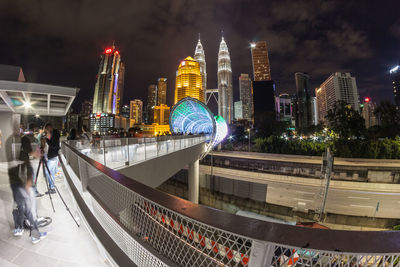 Illuminated modern buildings in city at night