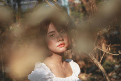 Portrait of young woman looking away