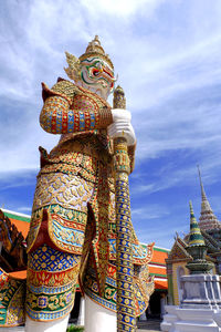 Low angle view of statue against sky