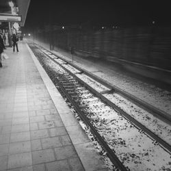 Railroad tracks on railroad station platform